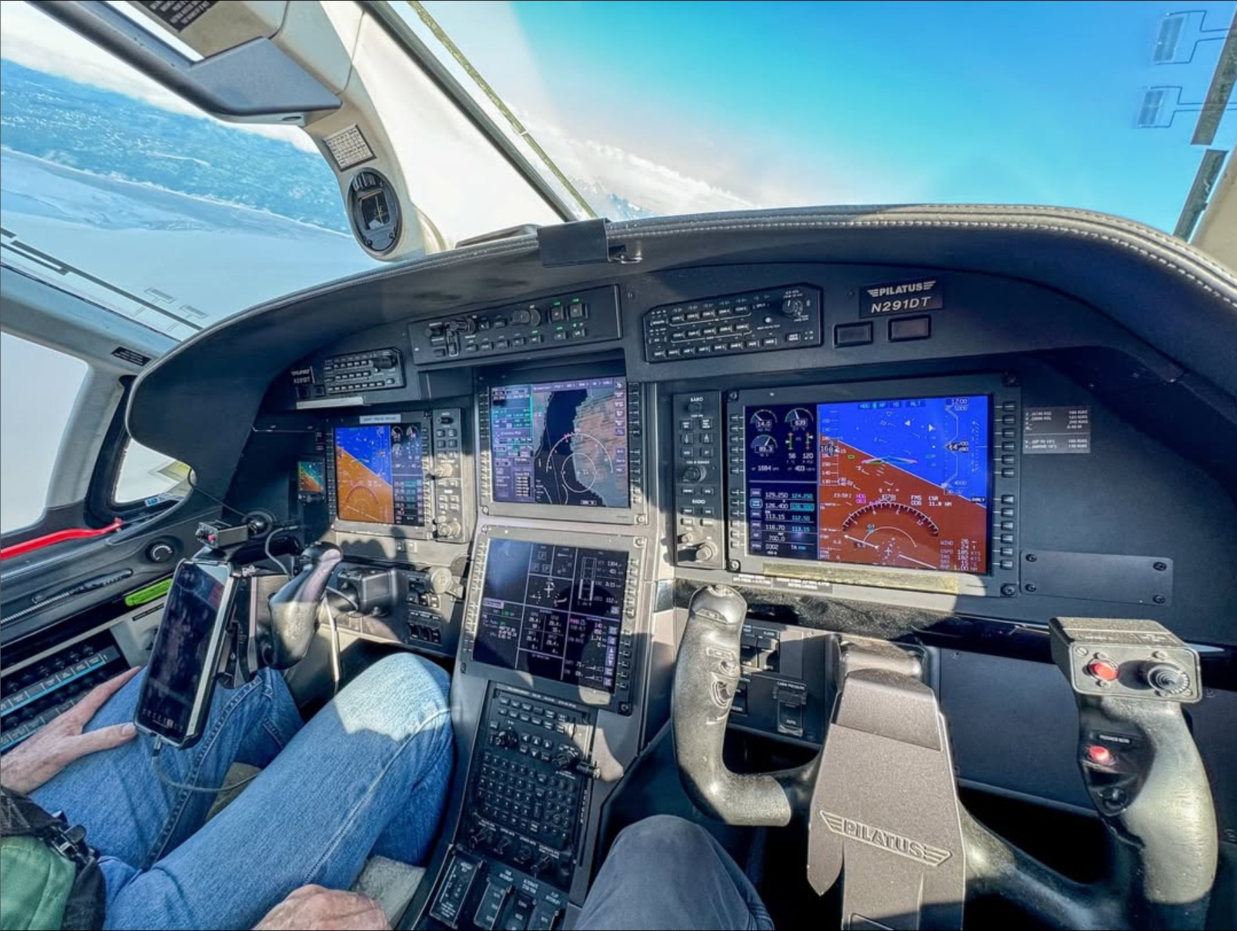 Pilatus cockpit instruments in flight over Alaska.